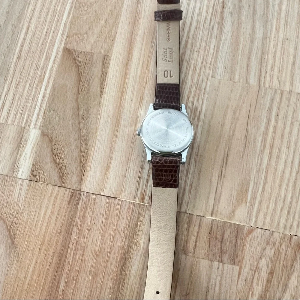 Caravelle by Bulova ladies silver tone brown leather dress watch NEW BATTERY
